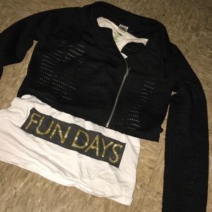 a white tank and black jacket